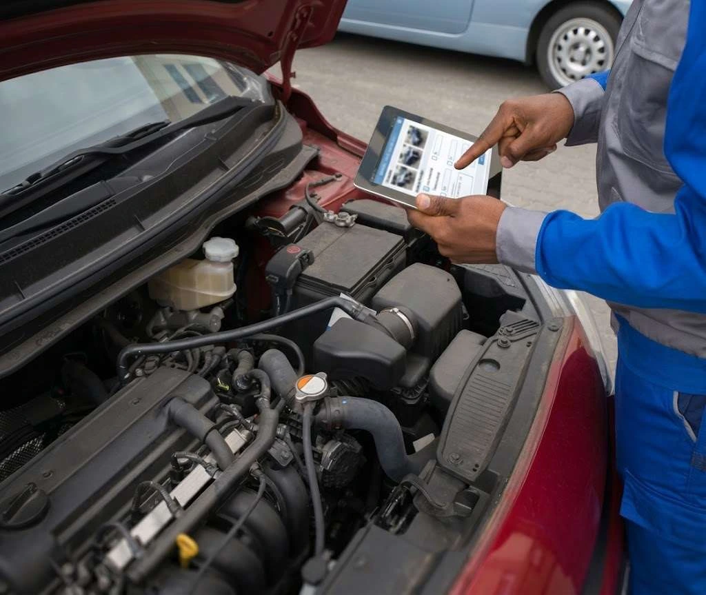 A technician capturing vehicle condition on a tablet