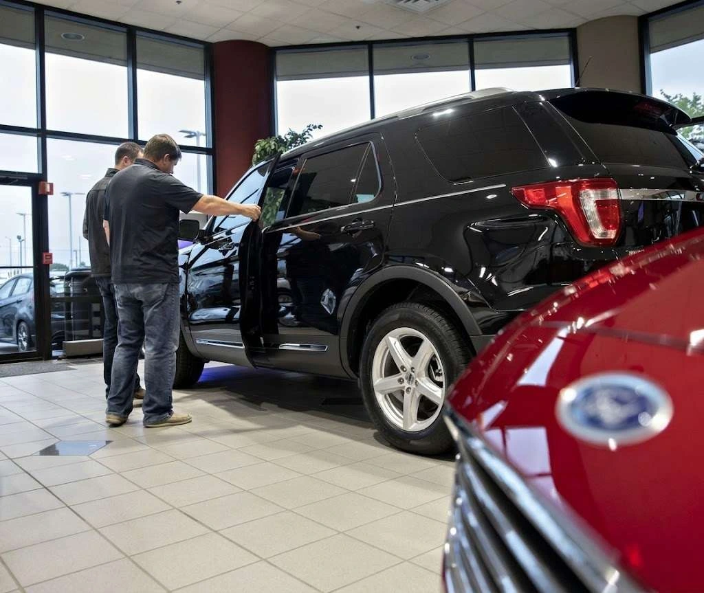 A buyer checking a used SUV in a dealership