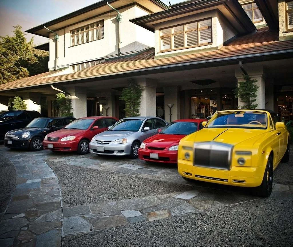 Everyday and luxury used cars parked in front of a dealership